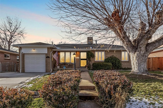 single story home with a garage