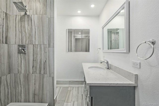 bathroom featuring vanity and walk in shower