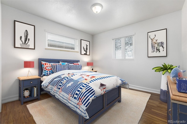 bedroom featuring dark hardwood / wood-style floors