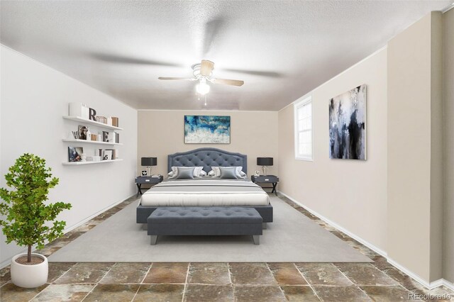 bedroom featuring a textured ceiling and ceiling fan