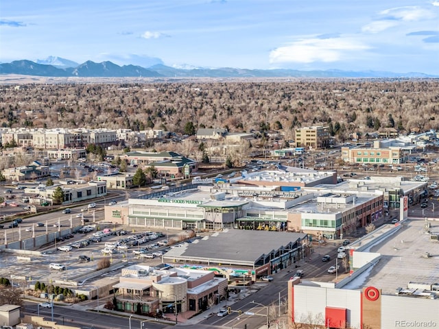 birds eye view of property with a mountain view