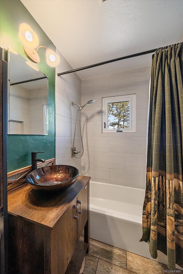 full bathroom featuring vanity and shower / bathtub combination with curtain