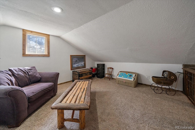 living area featuring lofted ceiling, carpet flooring, baseboards, and a textured ceiling