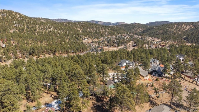 aerial view with a forest view and a mountain view