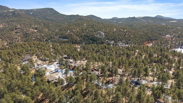 bird's eye view featuring a mountain view and a view of trees