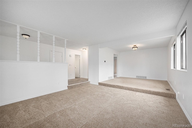 14190 E Gunnison Pl, Aurora, CO 80012 - carpeted empty room with baseboards and a textured ceiling