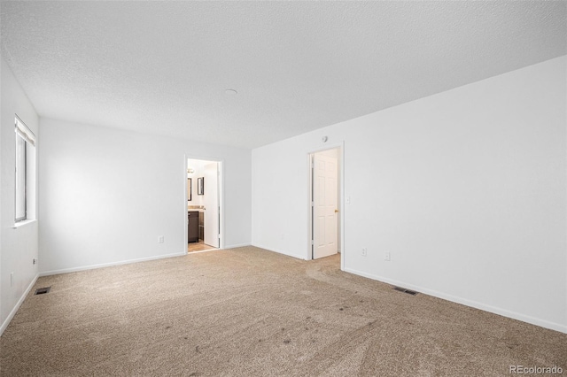 14190 E Gunnison Pl, Aurora, CO 80012 - spare room featuring light carpet and a textured ceiling