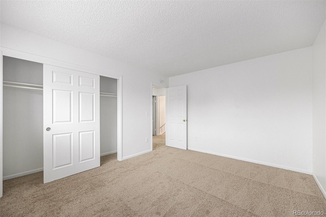 14190 E Gunnison Pl, Aurora, CO 80012 - unfurnished bedroom with carpet floors, a closet, and a textured ceiling