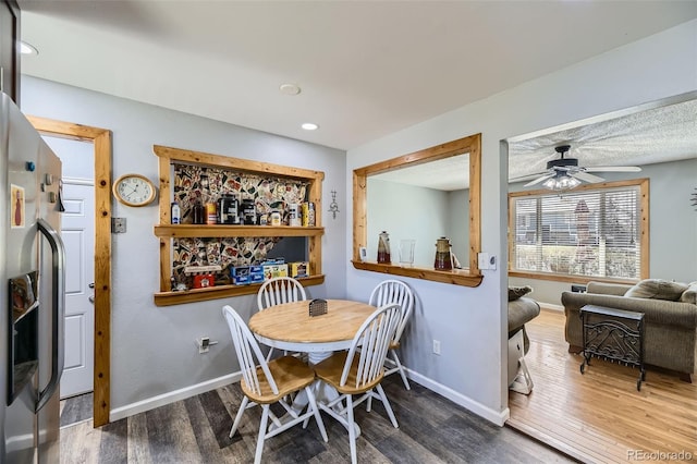 dining area with wood finished floors, baseboards, a ceiling fan, and recessed lighting