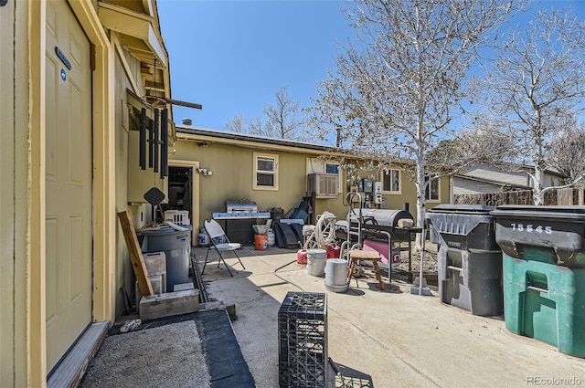 view of patio featuring fence