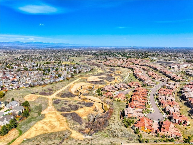 drone / aerial view featuring a mountain view and a residential view