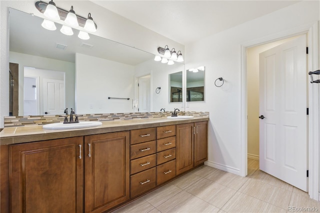 full bath featuring tile patterned floors, double vanity, a sink, and visible vents