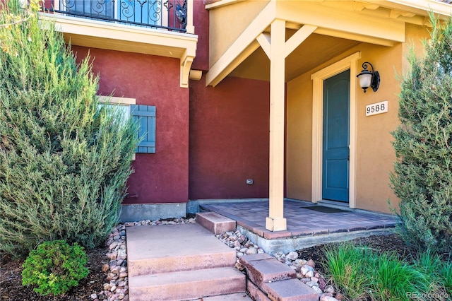9588 Firenze Way, Highlands Ranch, CO 80126 - property entrance featuring stucco siding