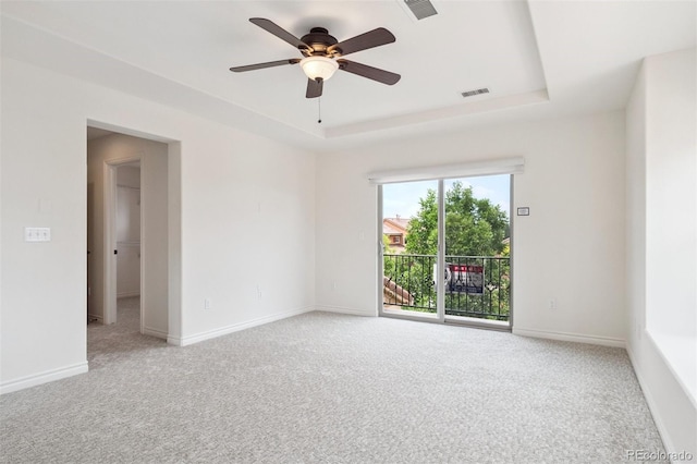 9588 Firenze Way, Highlands Ranch, CO 80126 - unfurnished room with a raised ceiling, light carpet, and a ceiling fan