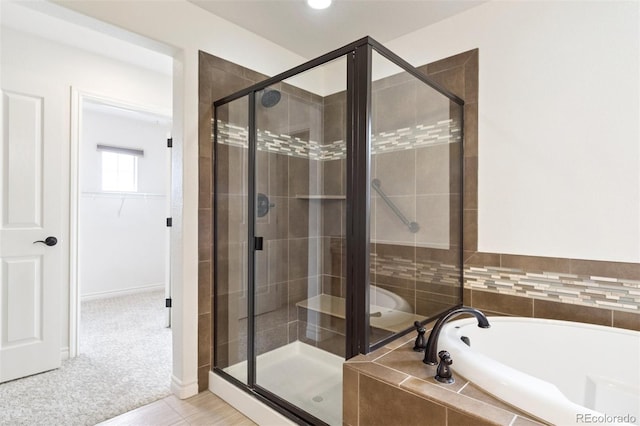 9588 Firenze Way, Highlands Ranch, CO 80126 - bathroom with a garden tub, a stall shower, and a walk in closet