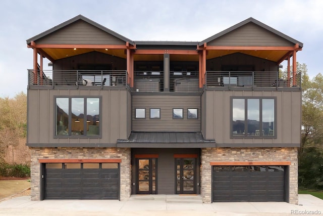 175 Whistlestop Cir, Winter Park, CO 80482 - view of front of property featuring an attached garage, driveway, and stone siding