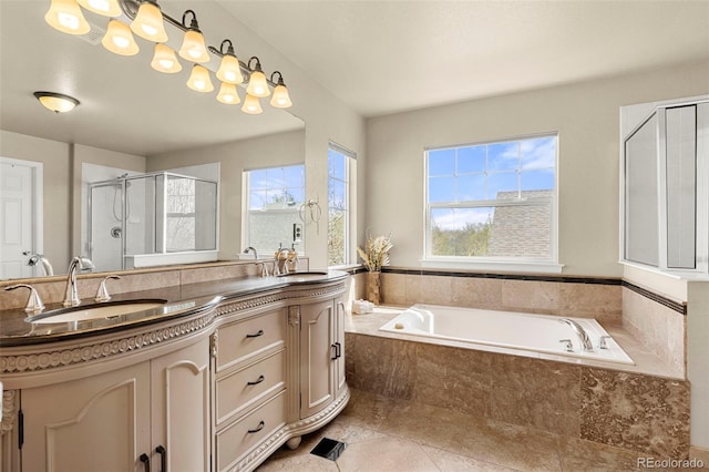 22 Apache Plume St, Brighton, CO 80601 - full bathroom featuring a stall shower, double vanity, a garden tub, and tile patterned floors