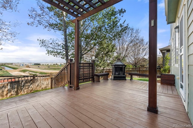 22 Apache Plume St, Brighton, CO 80601 - wooden terrace featuring a pergola and a fenced backyard