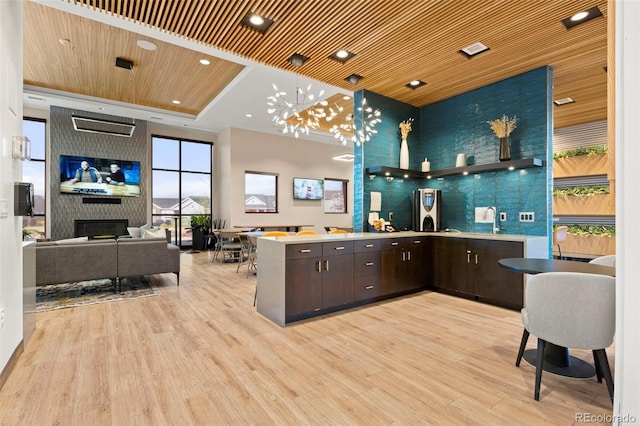 22 Apache Plume St, Brighton, CO 80601 - bar area featuring light wood-style floors, a sink, wooden ceiling, pendant lighting, and recessed lighting
