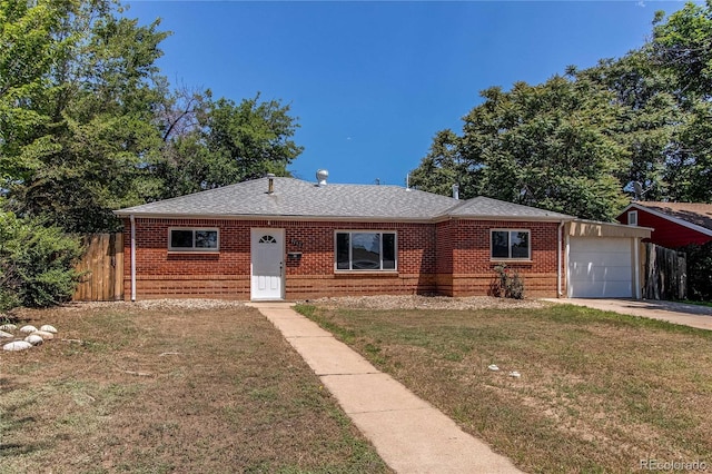 9150 Lilly Ct, Thornton, CO 80229 - view of front of home featuring brick siding, a garage, concrete driveway, and roof with shingles