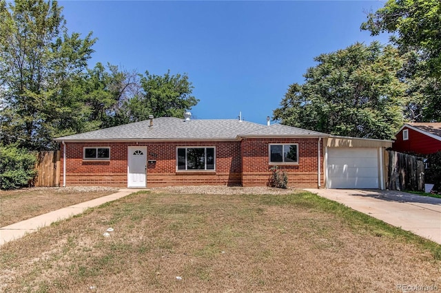9150 Lilly Ct, Thornton, CO 80229 - view of front of home with brick siding, an attached garage, concrete driveway, and roof with shingles