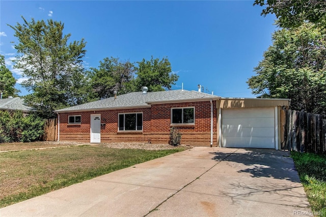 9150 Lilly Ct, Thornton, CO 80229 - view of front of home with brick siding, a garage, concrete driveway, and roof with shingles