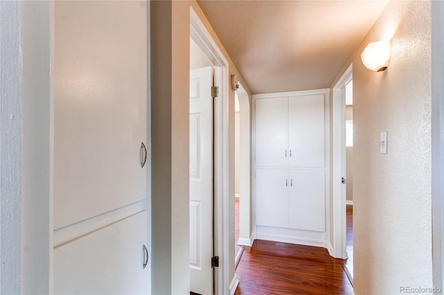 9150 Lilly Ct, Thornton, CO 80229 - corridor featuring wood finished floors and a textured wall