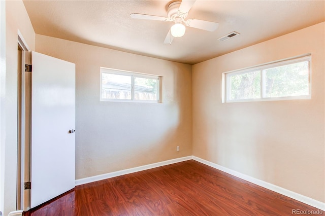 9150 Lilly Ct, Thornton, CO 80229 - spare room with dark wood finished floors, healthy amount of natural light, and a ceiling fan