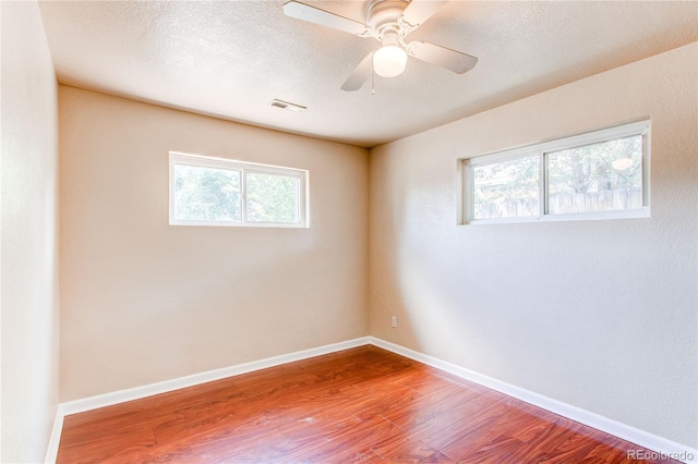 9150 Lilly Ct, Thornton, CO 80229 - spare room featuring healthy amount of natural light, wood finished floors, and a ceiling fan
