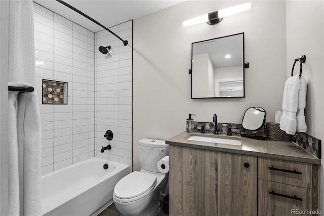 bathroom with shower / tub combo with curtain, vanity, and toilet