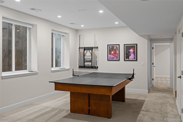 recreation room with recessed lighting, light carpet, and baseboards