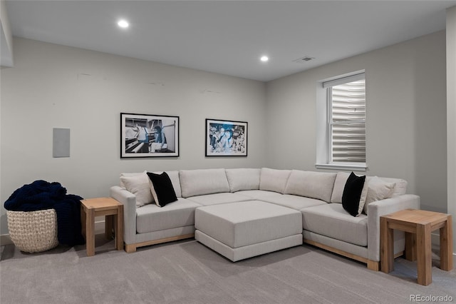 living room with visible vents, light colored carpet, and recessed lighting