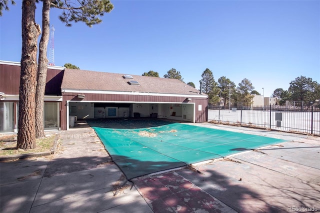 view of swimming pool featuring a patio area, fence, and a fenced in pool