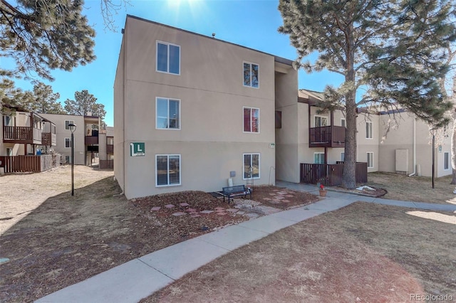 view of side of property with stucco siding