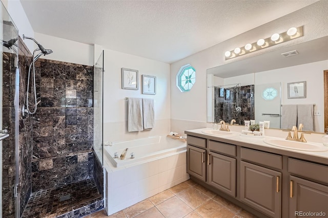 5394 S Valdai Way, Aurora, CO 80015 - bathroom featuring tiled shower, double vanity, a garden tub, tile patterned floors, and a textured ceiling