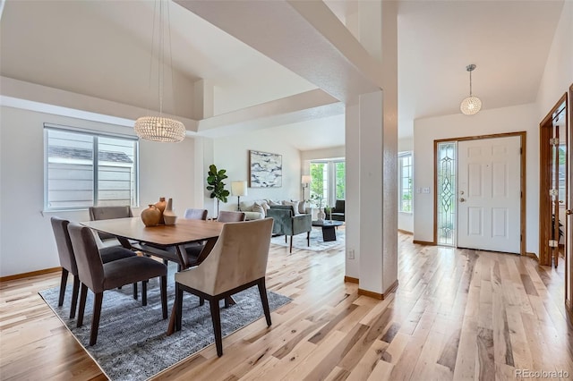5394 S Valdai Way, Aurora, CO 80015 - dining space with a chandelier, light wood-type flooring, and high vaulted ceiling
