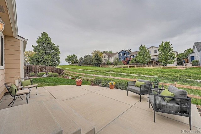 5394 S Valdai Way, Aurora, CO 80015 - fenced backyard featuring a patio, outdoor lounge area, and a residential view