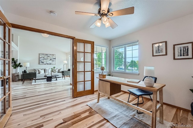5394 S Valdai Way, Aurora, CO 80015 - office area featuring french doors, light wood-style flooring, and ceiling fan