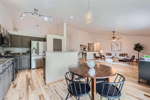 5394 S Valdai Way, Aurora, CO 80015 - dining area featuring light wood finished floors, a ceiling fan, and high vaulted ceiling