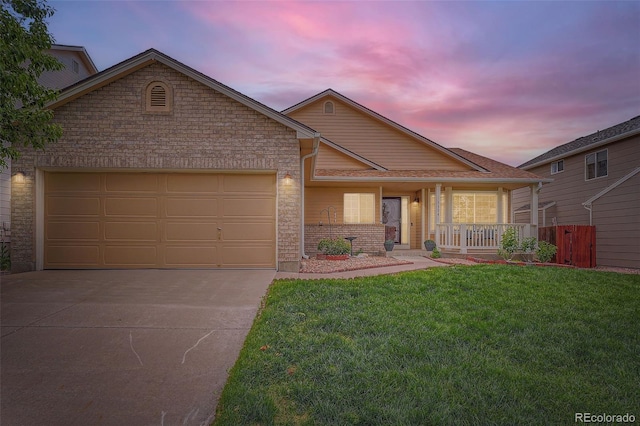 5394 S Valdai Way, Aurora, CO 80015 - ranch-style house featuring driveway, a porch, an attached garage, and brick siding