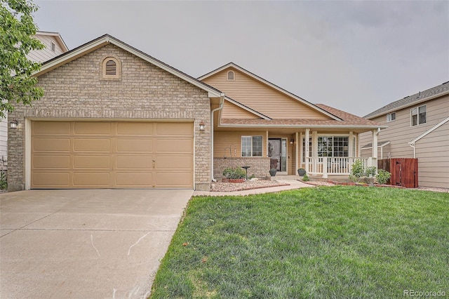 5394 S Valdai Way, Aurora, CO 80015 - view of front of house with a garage, concrete driveway, covered porch, and brick siding