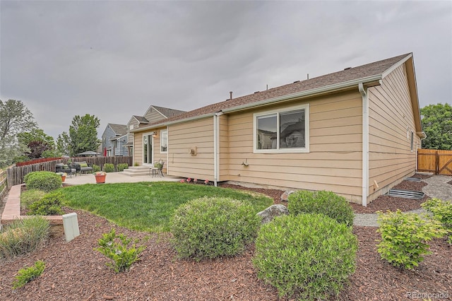 5394 S Valdai Way, Aurora, CO 80015 - rear view of property with a patio, a fenced backyard, and entry steps