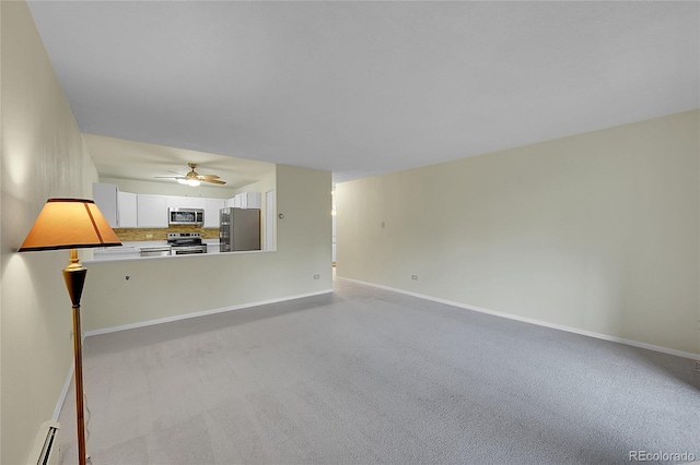 unfurnished living room featuring baseboard heating, ceiling fan, and light colored carpet