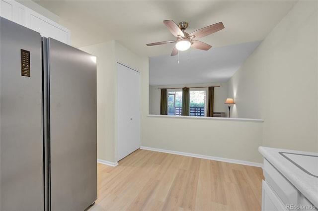 spare room with ceiling fan and light hardwood / wood-style flooring