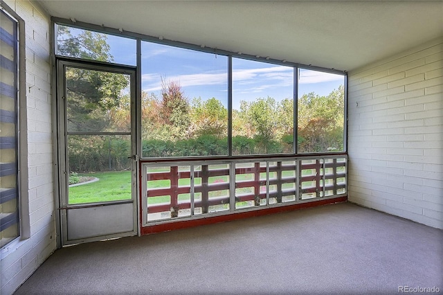 unfurnished sunroom with plenty of natural light