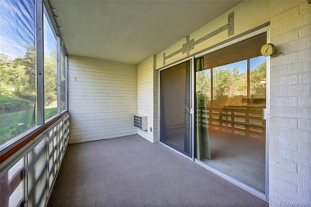 unfurnished sunroom with a wealth of natural light