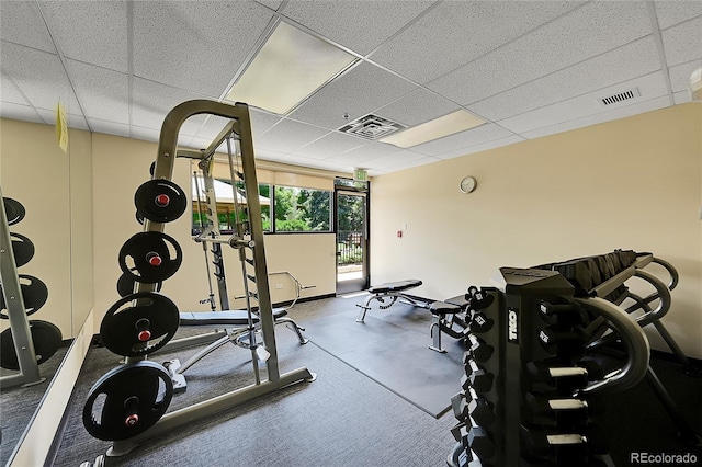 exercise room featuring a drop ceiling