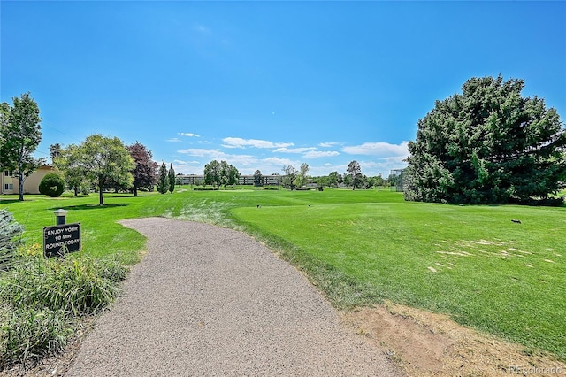 view of property's community with a lawn