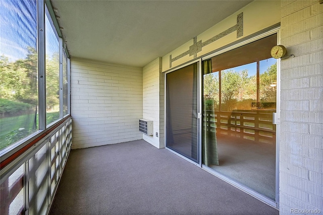 635 S Alton Way Unit 6A, Denver, CO 80247 - unfurnished sunroom with healthy amount of natural light and heating unit