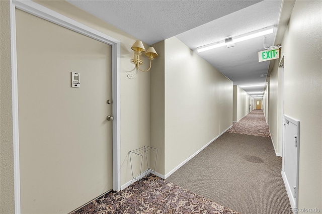 635 S Alton Way Unit 6A, Denver, CO 80247 - hallway featuring carpet, a textured ceiling, and baseboards